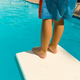 Illustration for article titled Cheer for this kid who conquered his diving board fears